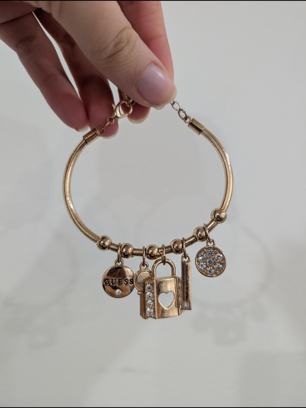GUESS Gold-Tone Charm Bracelet with Lock & Crystal Accents